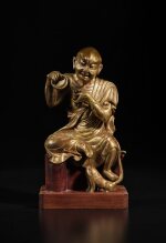 A gilt-bronze figure of Nakula, Ming dynasty | 明 銅鎏金靜坐羅漢像