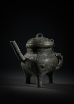An archaic bronze ritual tripod pouring vessel and cover (He), Late Shang / early Western Zhou dynasty | 商末 / 西周初 青銅獸面紋盉