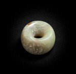 A celadon jade bead Neolithic period, Xilongwa culture | 新石器時代 興隆窪文化青白玉珠