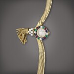 Reference 7368 | A yellow gold and diamond, emerald, ruby, and sapphire-set bracelet watch with decorative tassel, Made in 1959