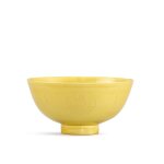 An incised yellow-glazed bowl, Mark and period of Kangxi 清康熙 黃釉暗刻團花紋盌 《大清康熙年製》款