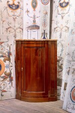 A large mahogany corner cabinet, Louis XVI | Grande encoignure en acajou flammé d'époque Empire