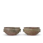 A pair of archaic bronze water basins (Jian), Eastern Zhou dynasty, late 6th - early 5th century BC | 東周 公元前六世紀末至五世紀初 青銅交龍紋鋪首耳鑒一對