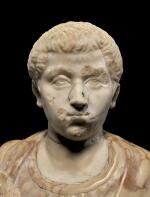 A ROMAN MARBLE PORTRAIT HEAD OF A YOUTH, SEVERAN, MID 3RD CENTURY A.D., ON 17TH CENTURY SHOULDERS