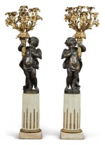 A PAIR OF MONUMENTAL PATINATED AND GILT-BRONZE NINE-LIGHT CANDELABRA ON GILT-BRONZE MOUNTED FLUTED WHITE MARBLE COLUMNS, 19TH CENTURY