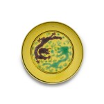 A green and aubergine enamelled yellow-ground 'dragon' dish Mark and period of Guangxu | 清光緒 黃地茄皮紫綠釉云龍戲珠紋盤 《大清光緒年製》款