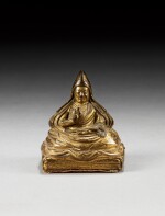 A gilt-bronze figure of the fifth Dalai Lama, Ngawang Lopsang Gyatso (1617-1682) Tibet, 17th-18th century | 西藏 十七至十八世紀 鎏金銅五世達賴喇嘛坐像