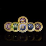  A HARLEQUIN SET OF SIX GILT AND ENAMELLED COLOURED-GLASS PLATES, BROCARD, CIRCA 1885