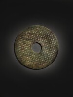 An archaic green jade disc (Bi), Han dynasty | 漢 玉蒲紋璧