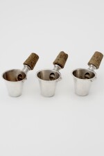  A SET OF THREE SILVER JIGGERS WITH BOTTLE STOPPERS