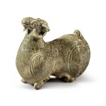 A celadon-glazed 'Yue' figure of a ram, Western Jin dynasty | 西晉 越窰青釉臥羊
