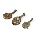 A group of three gilt-bronze belt hooks, Han dynasty | 漢 銅鎏金帶鉤一組三件