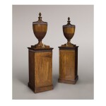 A PAIR OF GEORGE III EBONY AND BOXWOOD INLAID MAHOGANY URNS AND PEDESTALS IN THE MANNER OF GILLOWS, LATE 18TH CENTURY