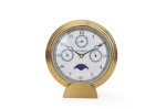 Brass table clock with day, date, month and moon phases  Circa 1999