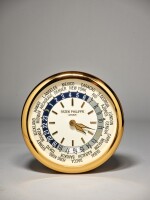 PATEK PHILIPPE/INDUCTA  |  A LARGE GILT BRASS WALL CLOCK WITH WORLD TIME DIAL, CIRCA 2000