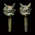 A pair of archaic bronze 'ox' linchpins Late Shang – early Western Zhou dynasty | 商晚期至西周早期 青銅牛首車轄一對