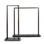 Two black lacquered metal and wood dress racks, modern