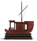 A RARE AND LARGE CARVED CINNABAR LACQUER BOAT-SHAPED INCENSE BOX QING DYNASTY, QIANLONG PERIOD | 清乾隆 剔紅八吉祥紋畫舫式香盒