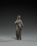 Etruscan Bronze Figure of a Goddess or Votary holding a Serpent, circa 3rd Century B.C.