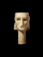 An Alabaster Head of a Woman, Southern Arabia, circa 1st Century B.C./1st Century A.D. 