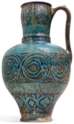 A RARE AND IMPORTANT KASHAN TURQUOISE GLAZED POTTERY PITCHER, PERSIA, CIRCA 1200-20 AD