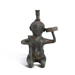 A bronze 'kneeling figure' lamp, Eastern Han dynasty | 東漢 青銅跪像燈