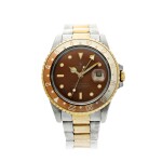 REFERENCE 16713 A STAINLESS STEEL AND YELLOW GOLD DUAL TIME WRISTWATCH WITH DATE AND BRACELET, CIRCA 1987