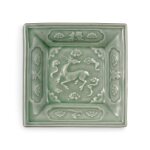 A rare molded 'Longquan' celadon-glazed 'deer' square dish, Yuan dynasty | 元 龍泉窰青釉「天之美祿」方盤