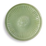 A 'LONGQUAN' CELADON-GLAZED MOLDED 'FLORAL' DISH, EARLY MING DYNASTY
