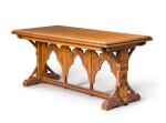 A Victorian carved oak and red painted centre table, circa 1870, in the manner of Charles Bevan