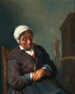 FOLLOWER OF ADRIAEN JANSZ VAN OSTADE | An old woman seated by a spinning wheel