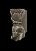 An Egyptian Greywacke or Green Schist Head of the Goddess Isis or Hathor, 26th Dynasty, 664-525 B.C.