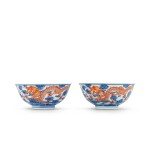 A pair of iron-red and underglaze-blue 'dragon' bowls Shendetang hall marks, Qing dynasty, 19th century | 清十九世紀 青花礬紅趕珠雲龍紋盌一對 《慎德堂製》款