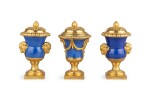 A late Louis XV gilt-bronze mounted Chinese powder-blue porcelain matched garniture, circa 1770 | Trois vases formant garniture en porcelaine à glaçure bleu poudré et monture de bronze doré de la fin de l'époque Louis XV, vers 1770