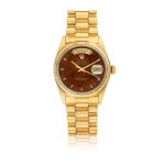 ROLEX | REF 18038 DAY-DATE, A YELLOW GOLD AUTOMATIC CENTER SECONDS WRISTWATCH WITH DAY, DATE, BRACELET, AND WOODEN DIAL CIRCA 1979