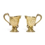 Two Victorian silver-gilt cream jugs, R. & S. Garrard & Co., London, 1874 and 1876