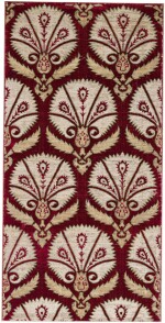 AN OTTOMAN VOIDED SILK VELVET METAL-THREAD (CATMA) PANEL WITH STYLISED PEACOCK FEATHERS WITHIN LARGE PALMETTES, TURKEY, BURSA OR ISTANBUL, EARLY 17TH CENTURY