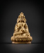 A gilt-copper alloy Padmasambhava Tibet, 19th century | 西藏 十九世紀 鎏金銅合金蓮花生大師坐像