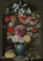 Still life of lilies, tulips, roses and other flowers in a glass vase with a goldfinch, grasshopper, bread, and a glass, all on a stone ledge in a niche