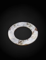 A partly calcified jade disc, huan Probably Han dynasty | 或為漢 玉環