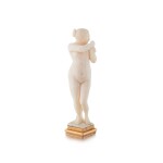 A French carved ivory gold seal with a naked Woman holding a dove, Late 19th century