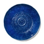 A carved blue-glazed dish, Qing dynasty, 18th century 