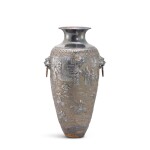 A large repoussé-decorated Chinese export silver vase, Qing dynasty, 19th century 清十九世紀 外銷銀舖首耳活環瓶