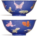 A PAIR OF POWDER-BLUE GROUND FAMILLE-ROSE 'BUTTERFLY' BOWLS JIAQING SEAL MARKS AND PERIOD | 清嘉慶 藍地粉彩百蝶紋盌一對 《大清嘉慶年製》款