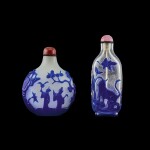 Two blue overlay glass snuff bottles, Qing dynasty, 19th century | 清十九世紀 珍珠地套藍料庭園仕女圖鼻煙壺 及 透明地套藍料耄耋圖鼻煙壺一組兩件