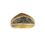 A rare and important Fatimid gold and enamelled archer's ring, Egypt, 11th century AD