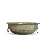 A gilt and silvered bronze 'dragon' basin, Western Han dynasty | 西漢 銅鎏金銀弦紋鋪首活環耳洗
