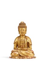 A rare gilt-lacquered soapstone figure of Buddha, Ming dynasty | 明 壽山石漆金佛坐像