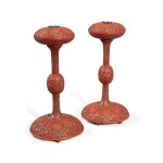 A pair of carved cinnabar lacquer 'Eight Buddhist Emblems' hat stands, Qing dynasty, Qianlong period | 清乾隆 剔紅纏枝蓮八吉祥紋冠架一對