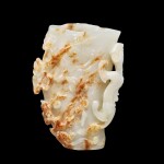 A white and russet jade 'chilong' flower receptacle Qing dynasty, Qianlong period | 清乾隆 白玉蟠龍梅花樁花插